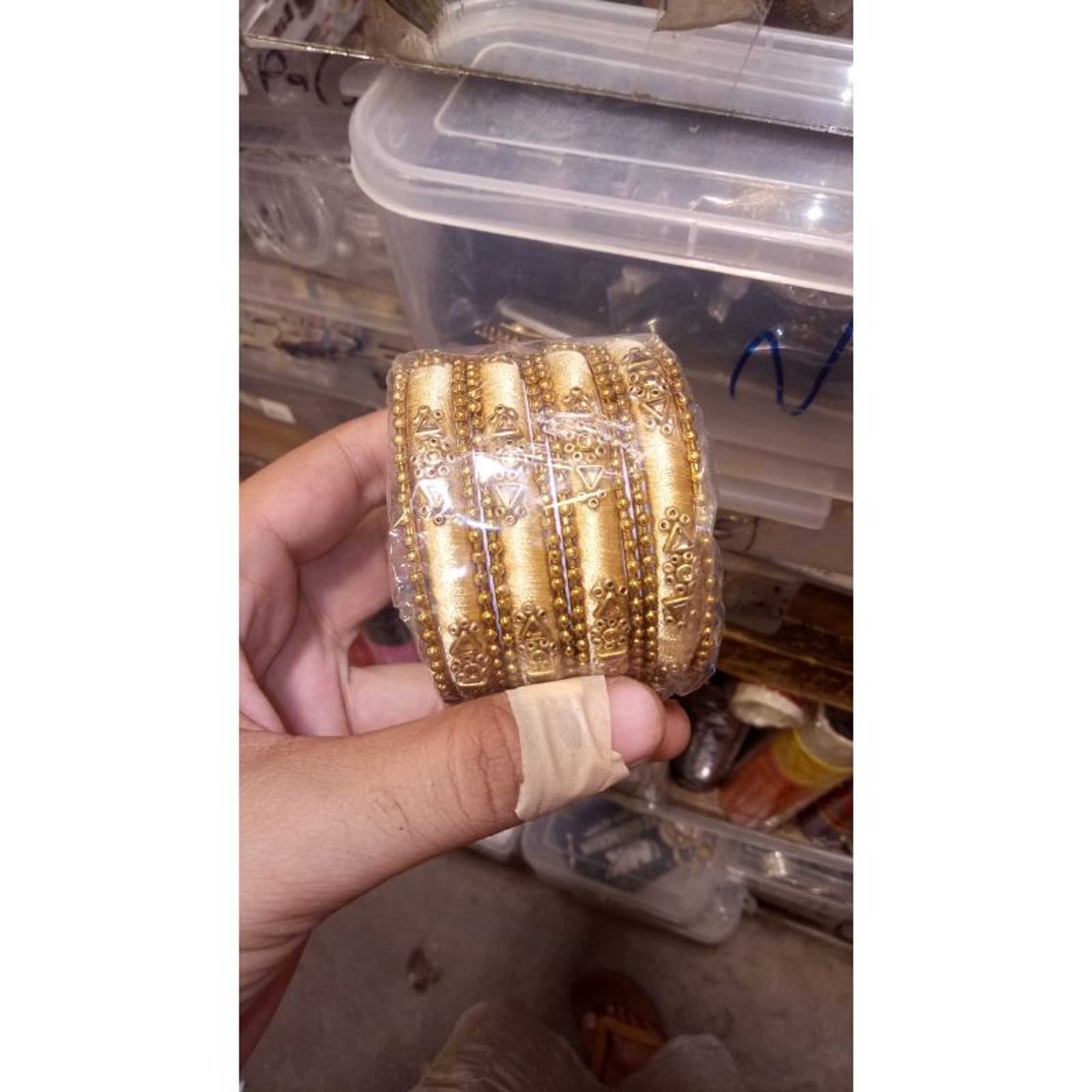 Four Bangles Set In Gold Color